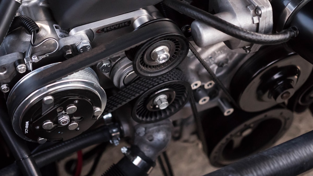 Close-up of an engine belt and pulley system